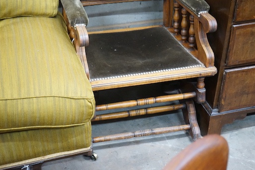 An early 20th century American upholstered mahogany rocking chair, width 58cm, depth 52cm, height 102cm